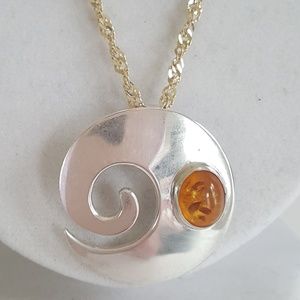Sterling swirl modernist Amber pendant on a 20" sterling chain